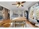 Dining area with wood floors and view into the kitchen area with island seating at 405 Miller Rd, Covington, GA 30014