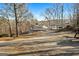 The wide, long driveway is perfect for multiple vehicles and leads to the house and attached carport at 405 Miller Rd, Covington, GA 30014
