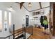 Entryway with wood floors, white walls, black door, and staircase with black metal railing at 405 Miller Rd, Covington, GA 30014