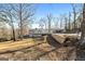 Charming home featuring an oversized carport, a back deck and well-maintained landscaping at 405 Miller Rd, Covington, GA 30014