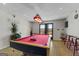 Recreation room with a billiard table and sliding doors with lake view at 405 Miller Rd, Covington, GA 30014