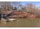 Picturesque lake view with a private dock, waterfront access, and a charming home nestled among the trees at 405 Miller Rd, Covington, GA 30014