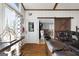 Cozy interior view with barn door, hardwood floors, and comfortable leather furniture at 405 Miller Rd, Covington, GA 30014