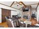 Inviting living room with brick fireplace, wood floors, and comfortable leather seating at 405 Miller Rd, Covington, GA 30014