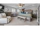 Comfortable main bedroom with neutral tones, ceiling fan, and stylish furnishings at 405 Miller Rd, Covington, GA 30014