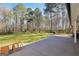 Expansive backyard with mature trees, a patio area perfect for outdoor entertaining and relaxation at 950 Besse Way, Locust Grove, GA 30248