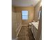 Bathroom featuring a tub, toilet, and single sink vanity with neutral tones at 3081 Regal Dr, Mcdonough, GA 30253