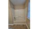 Bathroom showing a tub with shower and window at 3081 Regal Dr, Mcdonough, GA 30253