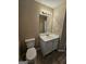 Bathroom featuring the vanity with a white sink and a toilet at 3081 Regal Dr, Mcdonough, GA 30253