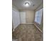 Cozy bedroom with tile flooring, a closet, and a window offering natural light at 3081 Regal Dr, Mcdonough, GA 30253