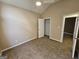 Bedroom featuring vaulted ceiling, ceiling fan, closet and neutral colored walls at 3081 Regal Dr, Mcdonough, GA 30253