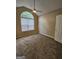 Bedroom featuring vaulted ceiling, ceiling fan, and large arched window at 3081 Regal Dr, Mcdonough, GA 30253