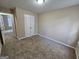 Bedroom with neutral walls, carpet, and a closet for storage at 3081 Regal Dr, Mcdonough, GA 30253