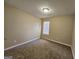 Bedroom with neutral walls, carpet, and a window providing natural light at 3081 Regal Dr, Mcdonough, GA 30253