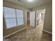 Bright dining area featuring neutral walls, tile floors, and view into the updated kitchen at 3081 Regal Dr, Mcdonough, GA 30253
