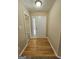 Inviting entryway features hardwood floors, a white front door with glass, and neutral wall colors at 3081 Regal Dr, Mcdonough, GA 30253