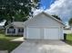 Exterior of the home showcasing the garage doors and driveway at 3081 Regal Dr, Mcdonough, GA 30253