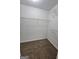Walk-in closet featuring carpet floors, wire shelving, and neutral walls at 3081 Regal Dr, Mcdonough, GA 30253