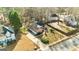 Aerial view of a home with driveway, lawn and surrounding trees, located in a quiet neighborhood at 418 Crosshaven Way, Mcdonough, GA 30253
