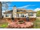 Backyard with brick patio, shade sail, fire pit, and a view of the home's exterior at 418 Crosshaven Way, Mcdonough, GA 30253