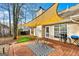Backyard brick patio featuring shade sail and outdoor seating with a view of the home at 418 Crosshaven Way, Mcdonough, GA 30253