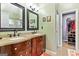 Ensuite bathroom with dual sinks, granite countertops, and walk-in closet at 418 Crosshaven Way, Mcdonough, GA 30253