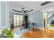 Bright dining area with modern ceiling fan, area rug, and view of stairway to the upper level at 418 Crosshaven Way, Mcdonough, GA 30253