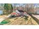 Well-maintained brick home with blue shutters, complemented by mature trees and green lawn at 418 Crosshaven Way, Mcdonough, GA 30253