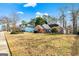 Charming brick home with blue shutters and a spacious front yard, showcasing curb appeal at 418 Crosshaven Way, Mcdonough, GA 30253