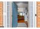 Entryway view of a living room with hardwood floors and a cozy sofa at 418 Crosshaven Way, Mcdonough, GA 30253