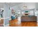 Bright open concept living room features a fireplace and hardwood floors at 418 Crosshaven Way, Mcdonough, GA 30253