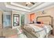 Bright main bedroom with bedside tables and ensuite bathroom and closet at 418 Crosshaven Way, Mcdonough, GA 30253