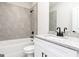 Bathroom showcases a granite countertop, white vanity, and tiled shower/tub at 3382 Arabian Farm Ln, Dacula, GA 30019