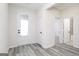 Bright entryway with gray flooring, white walls, and doors leading to various rooms in the home at 3382 Arabian Farm Ln, Dacula, GA 30019