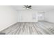 Bright and airy living room with gray flooring and lots of natural light streaming through the windows at 3382 Arabian Farm Ln, Dacula, GA 30019