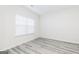 Bright, neutral bedroom with modern flooring, a large window for natural light, and ample space at 3734 Saddle Bag Ct, Dacula, GA 30019