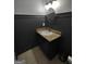 Stylish bathroom featuring a vanity with granite countertop, modern sink, and decorative mirror at 57 Deer Creek Run, Moreland, GA 30259