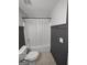 Clean bathroom showcasing a shower-tub combination with white shower curtain at 57 Deer Creek Run, Moreland, GA 30259