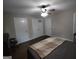 Large bedroom featuring a plush bed and hardwood floors at 57 Deer Creek Run, Moreland, GA 30259