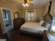 Comfortable bedroom featuring a ceiling fan and natural light from the bright window at 57 Deer Creek Run, Moreland, GA 30259