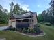Exterior view of house with stone accents and landscaping at 57 Deer Creek Run, Moreland, GA 30259