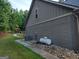Exterior home view with a brick foundation and a propane tank at 57 Deer Creek Run, Moreland, GA 30259