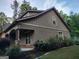 Attractive home featuring stone accents, manicured landscaping, and lush green lawn at 57 Deer Creek Run, Moreland, GA 30259