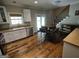 Modern kitchen featuring hardwood floors, modern appliances, white cabinets, and granite countertops at 57 Deer Creek Run, Moreland, GA 30259