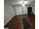 Spacious workout room with hardwood floors, a ceiling fan, and exercise equipment at 57 Deer Creek Run, Moreland, GA 30259