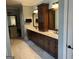 Spacious bathroom with double vanity, dark cabinets, and modern fixtures at 2220 Cambridge Hill Ct, Dacula, GA 30019