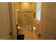 Bathroom with a glass-enclosed shower and neutral tile, providing a clean and modern space at 2220 Cambridge Hill Ct, Dacula, GA 30019
