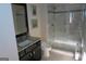 Stylish bathroom featuring a granite vanity and a spacious glass-enclosed shower at 2220 Cambridge Hill Ct, Dacula, GA 30019