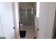 Bathroom featuring a glass shower and a toilet at 2220 Cambridge Hill Ct, Dacula, GA 30019