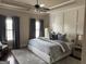 Serene bedroom with tray ceiling, soft color palette, and elegant furnishings at 2220 Cambridge Hill Ct, Dacula, GA 30019